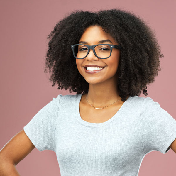 woman smiling with hands on hips